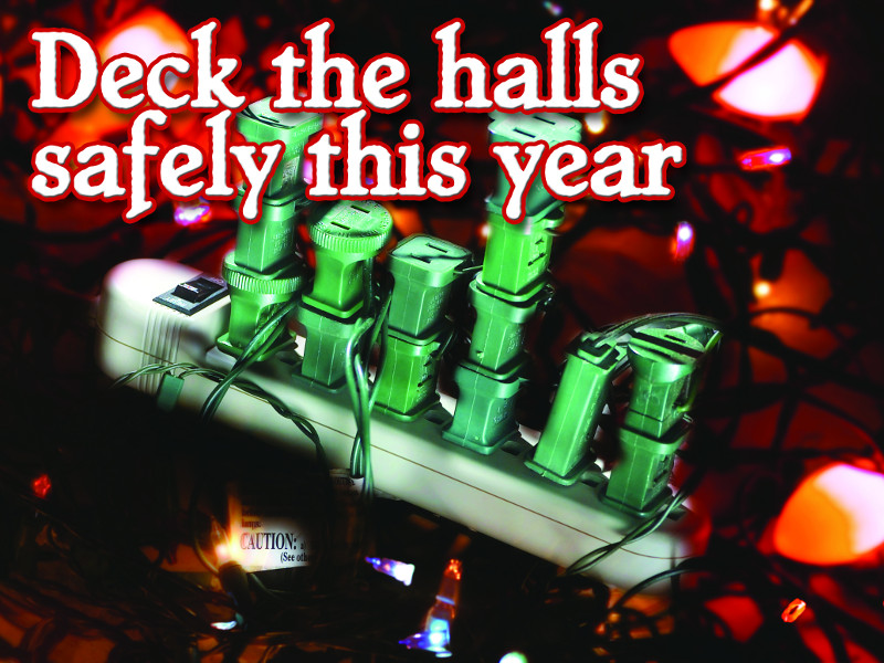 Deck the halls safely this year. Surge protector with fourteen Christmas light cords plugged into it with a caution tag