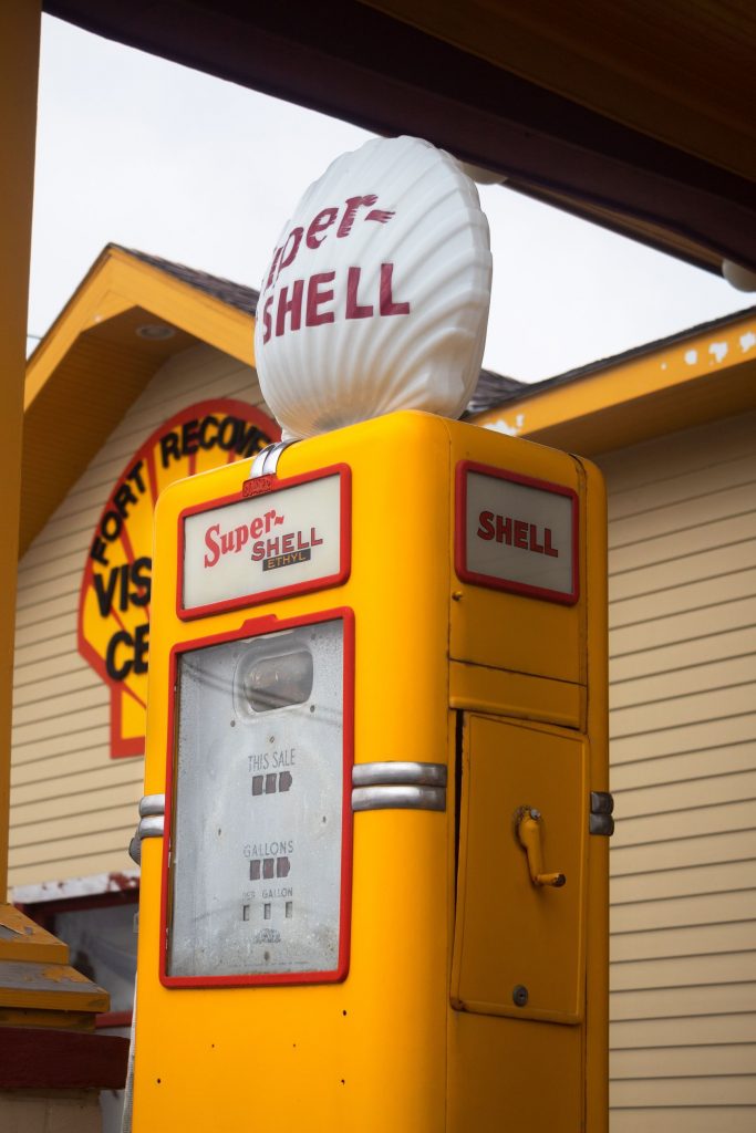 Yellow and red Super Shell Ethyl gas pump with while seashell on top
